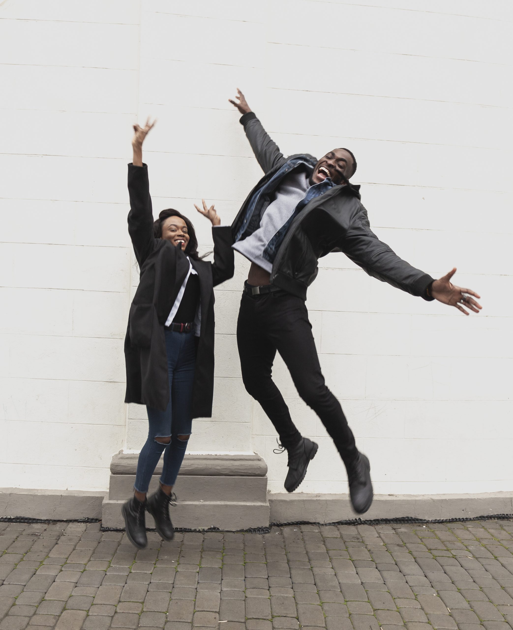 happy-afroamerican-couple-jumping-full-shot